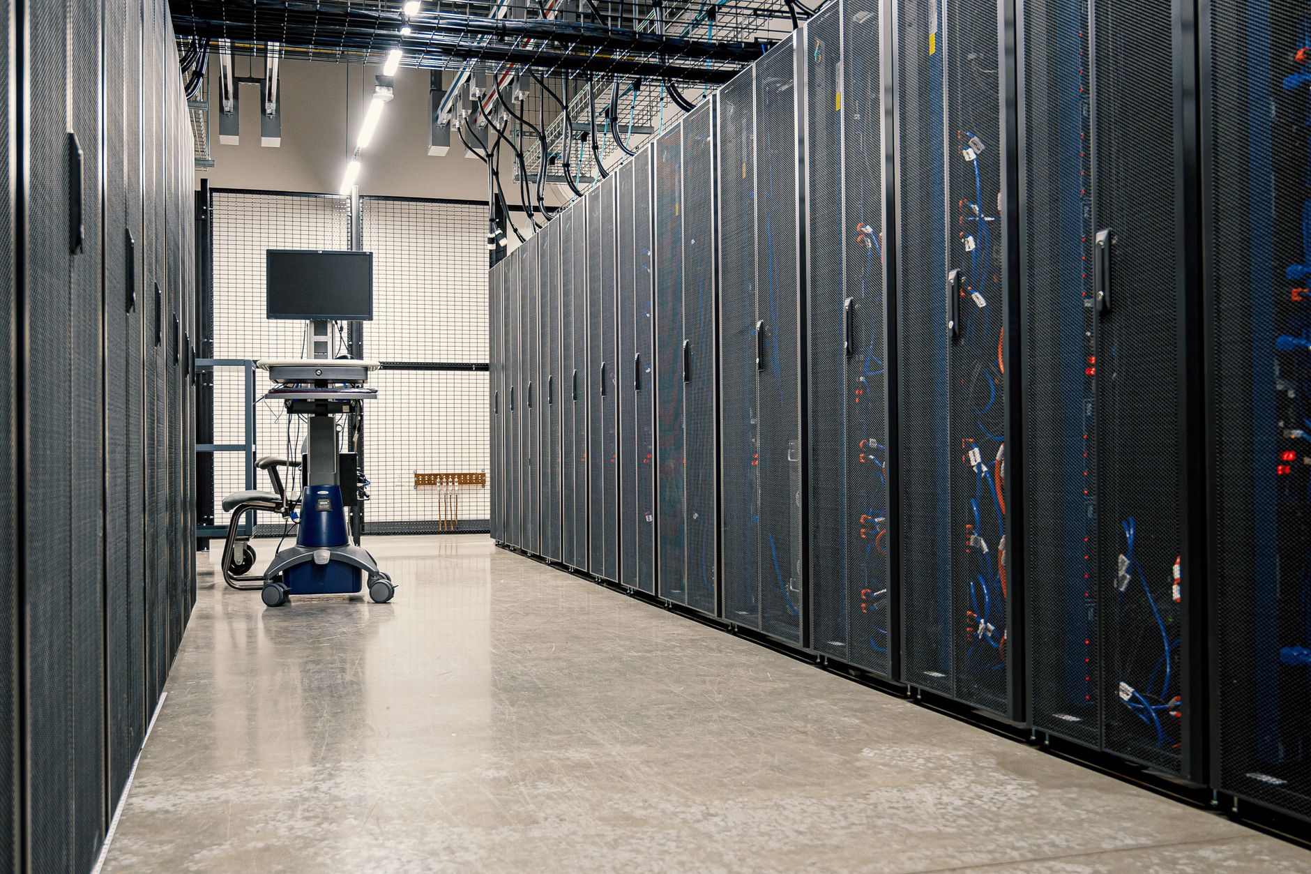 Server racks and networking equipment in a data center.