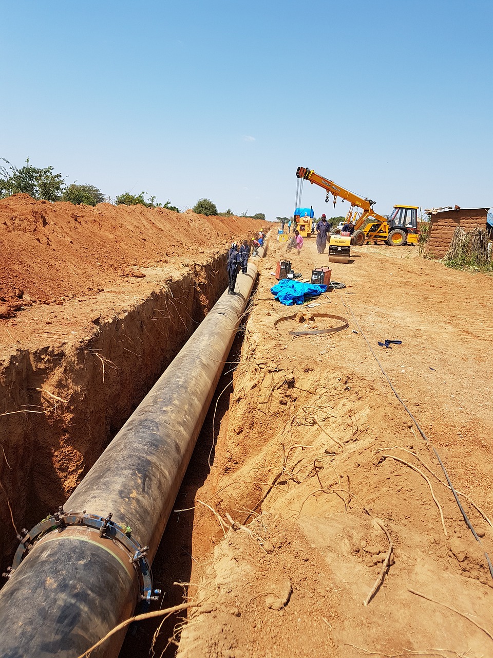 A trenching machine works at a pipeline construction site.