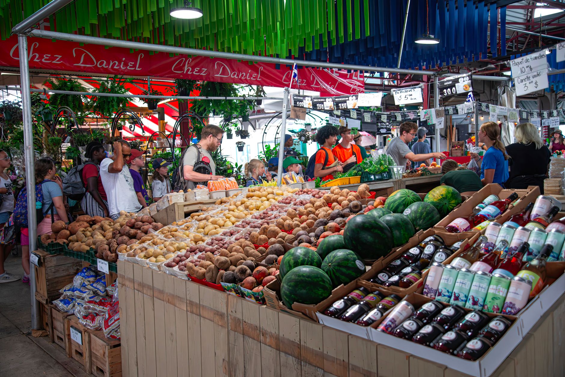 An indoor market scene illustrates the type of year-round food marketplace proposed as a potential East Bookend public benefit.