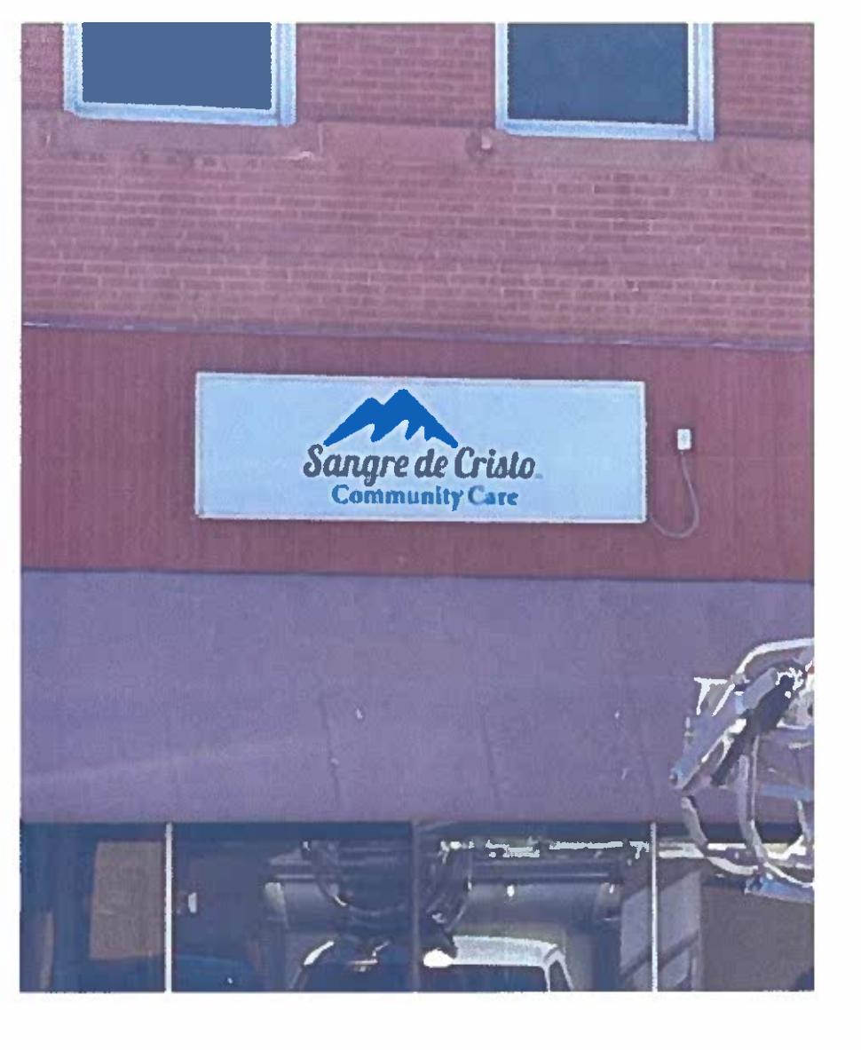 Sangre de Cristo Community Care’s existing storefront sign at its La Junta building. The organization’s Spark Grant application proposed sign improvements.