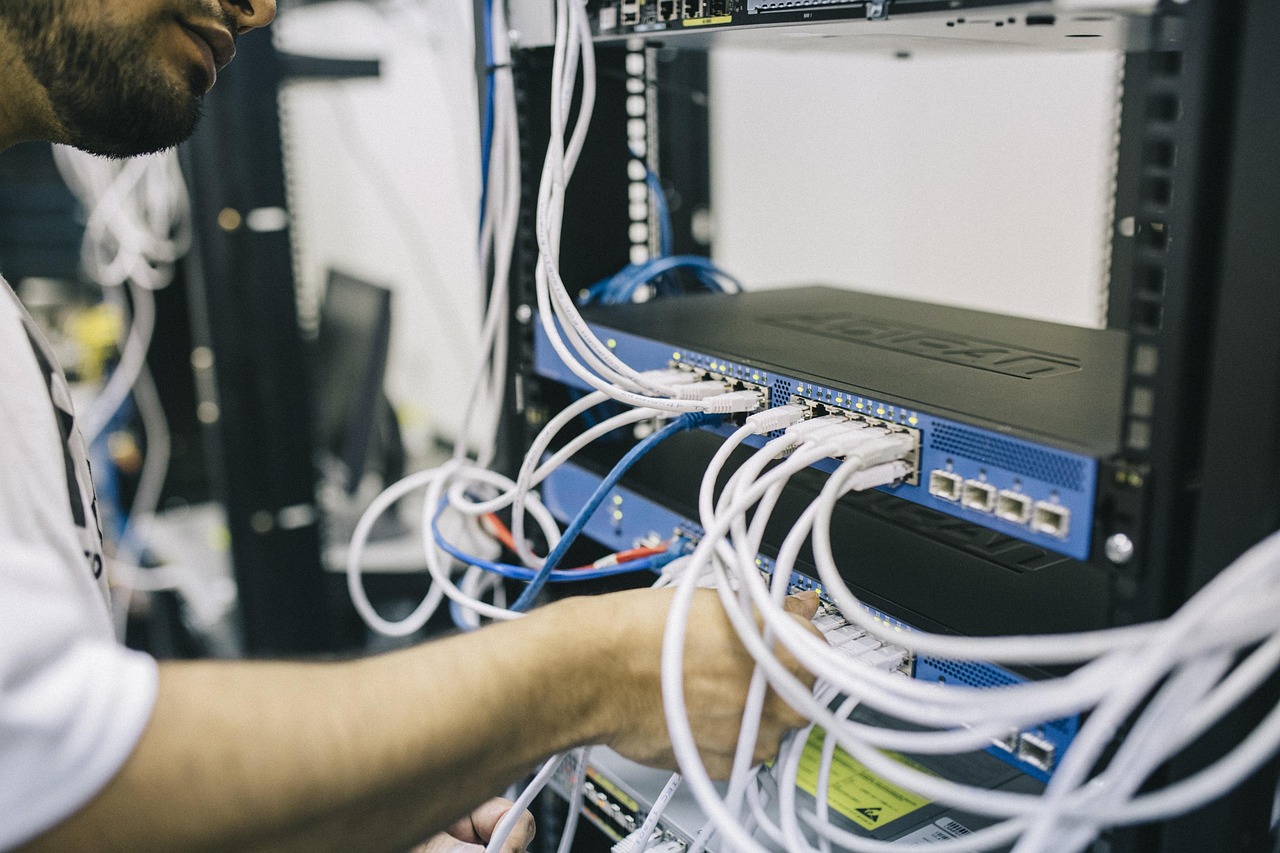 Fiber and network cabling connected to telecommunications equipment.