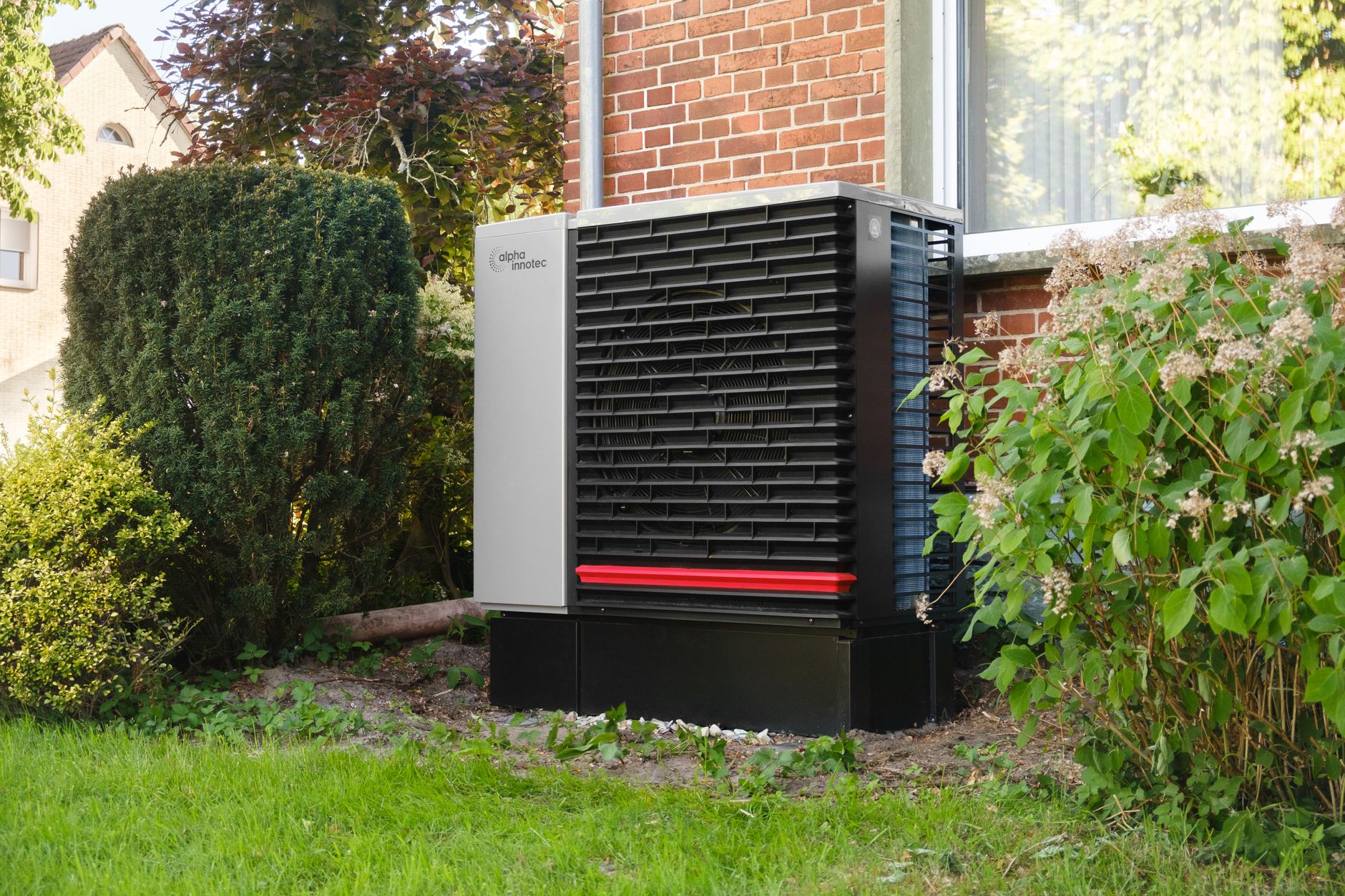 An outdoor heat pump beside a home.